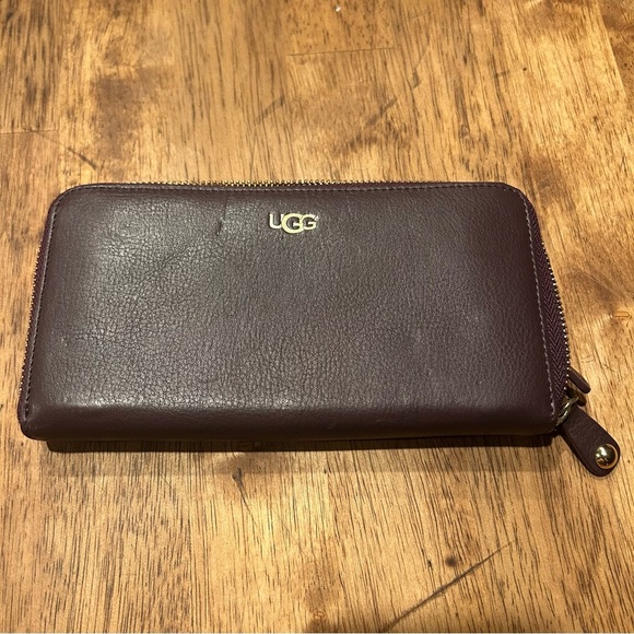 UGG Accessories - UGG Burgundy/purple leather zip around accordion wallet.